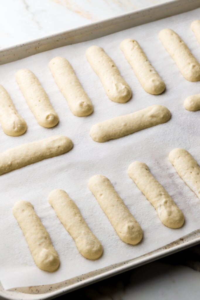 pipe the biscuit batter onto a lined cookie sheet