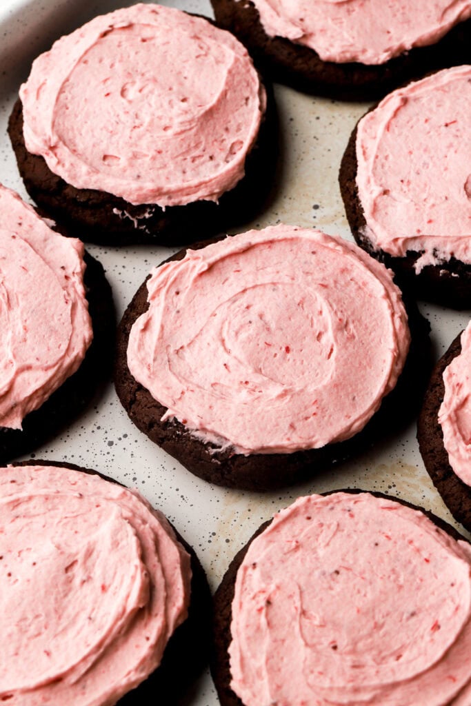 chocolate cookies frosted with strawberry frosting