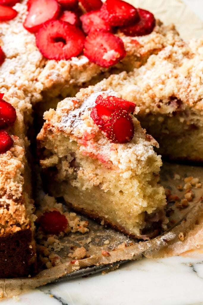 slice of strawberry muffin cake with a bite taken out