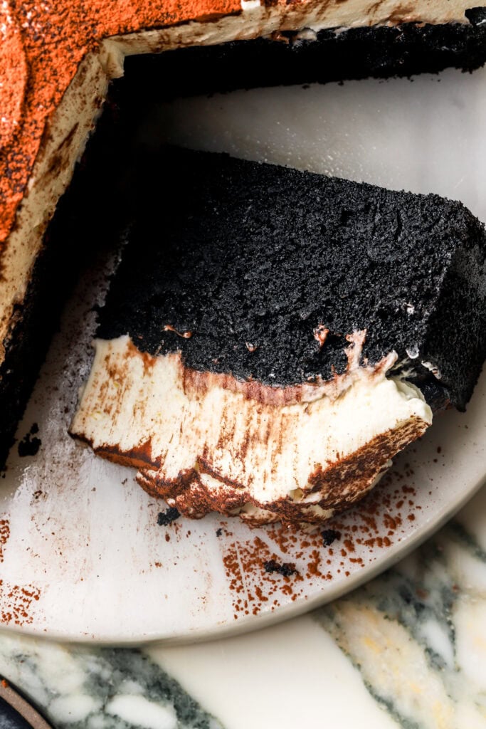 slice of black cocoa cake on its side