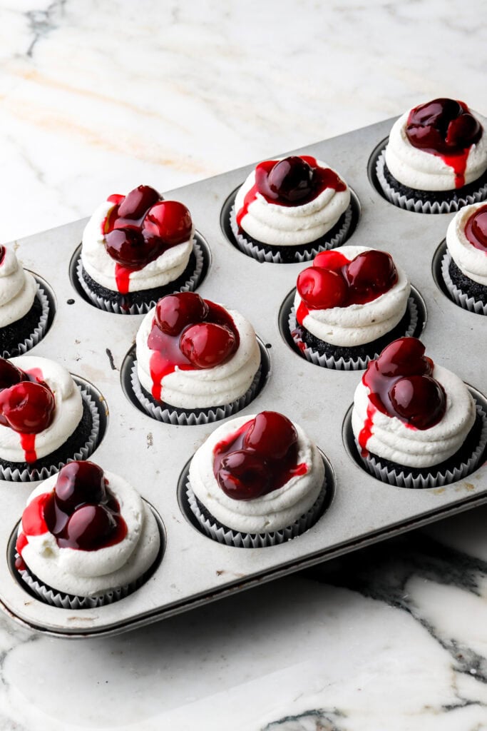 cupcakes topped with cherry sauce