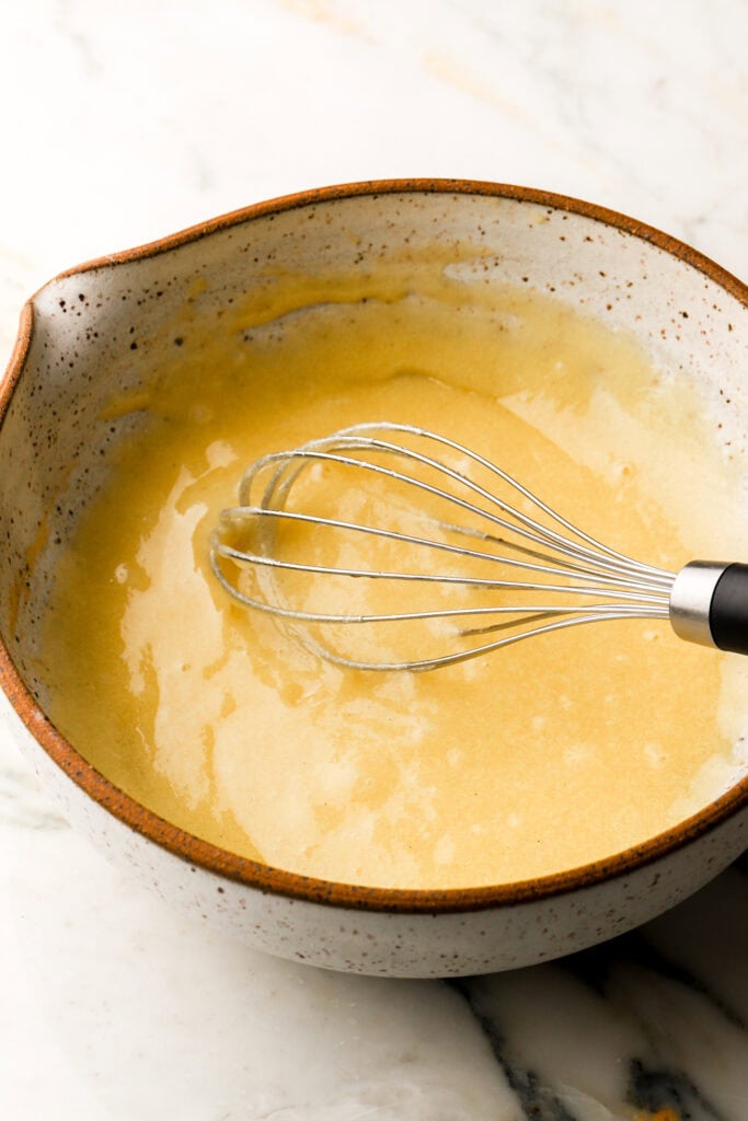 whisk together sugar, oil and eggs