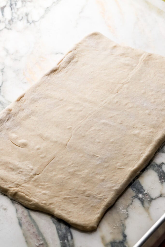 roll out dough and butter gently into a rectangle again 