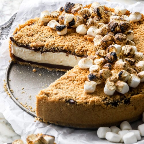 no-bake s'mores cheesecake with a slice cut out