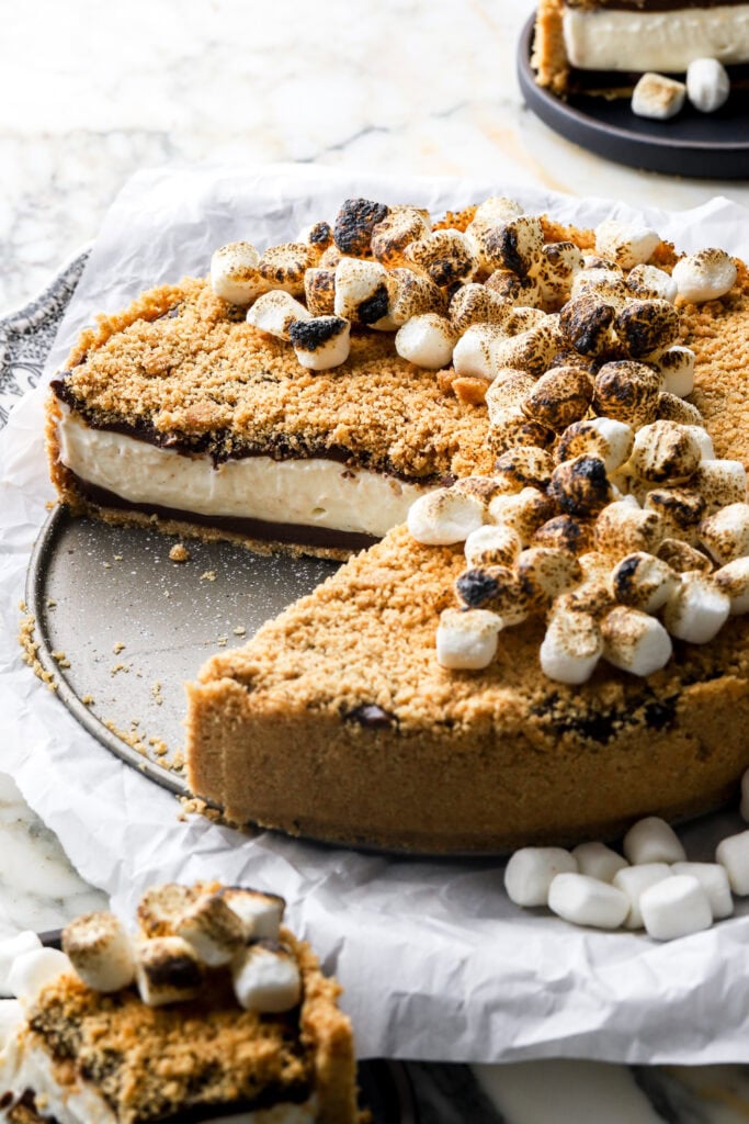 no-bake s'mores cheesecake with a slice cut out