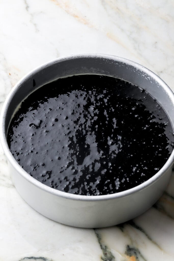 black cocoa cake batter in prepared pan