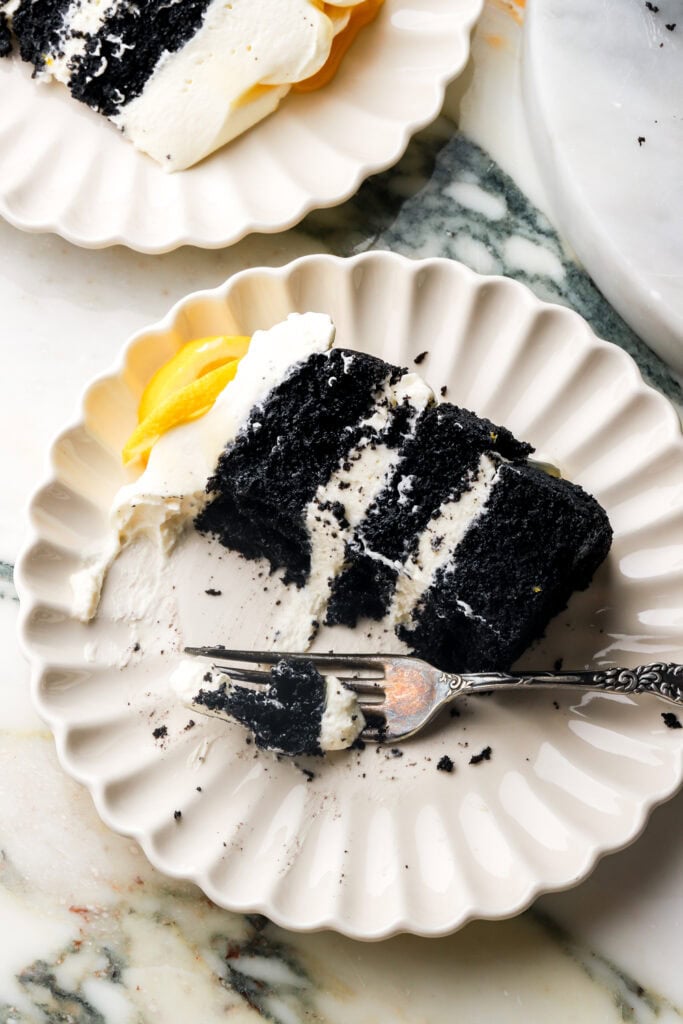 slice of lemon chocolate cake on a plate with a fork