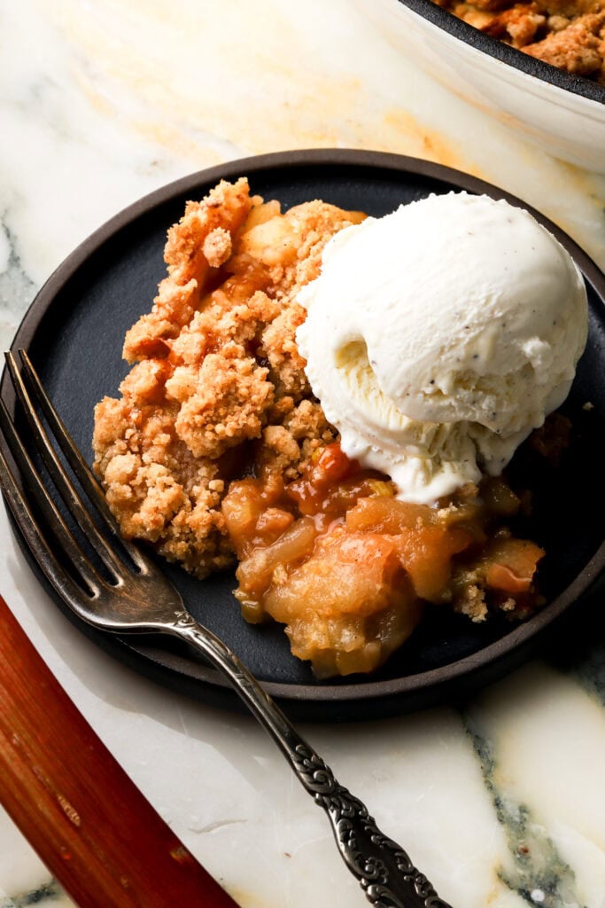 apple and rhubarb crisp topped with ice cream