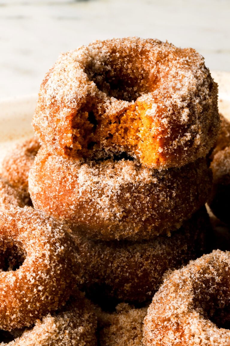 pumpkin donuts covered in cinnamon sugar