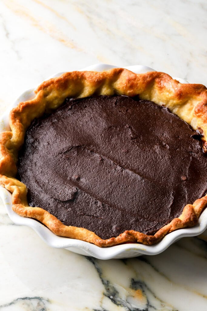 brownie batter spread into par-baked crust