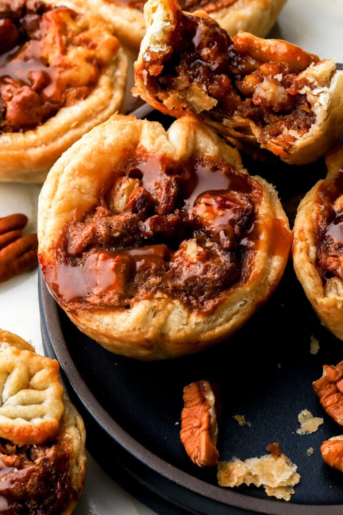 mini pecan pies with a bite taken out of one