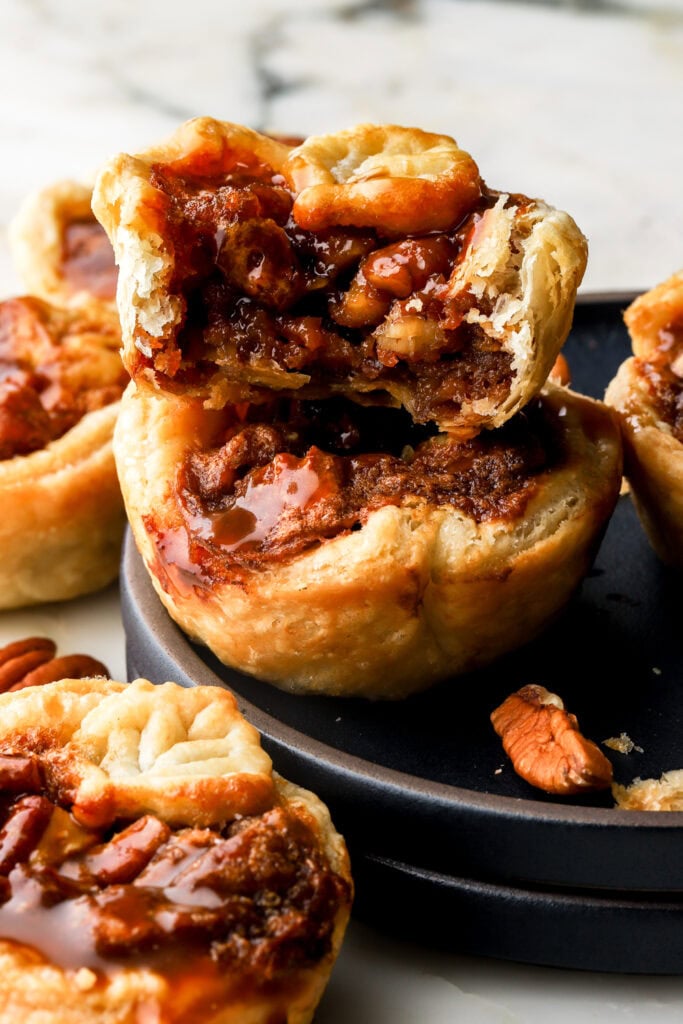 mini pecan pies topped with extra salted caramel sauce