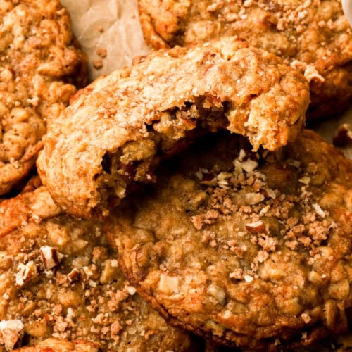 close up of a pecan oatmeal cookie with a bite taken out