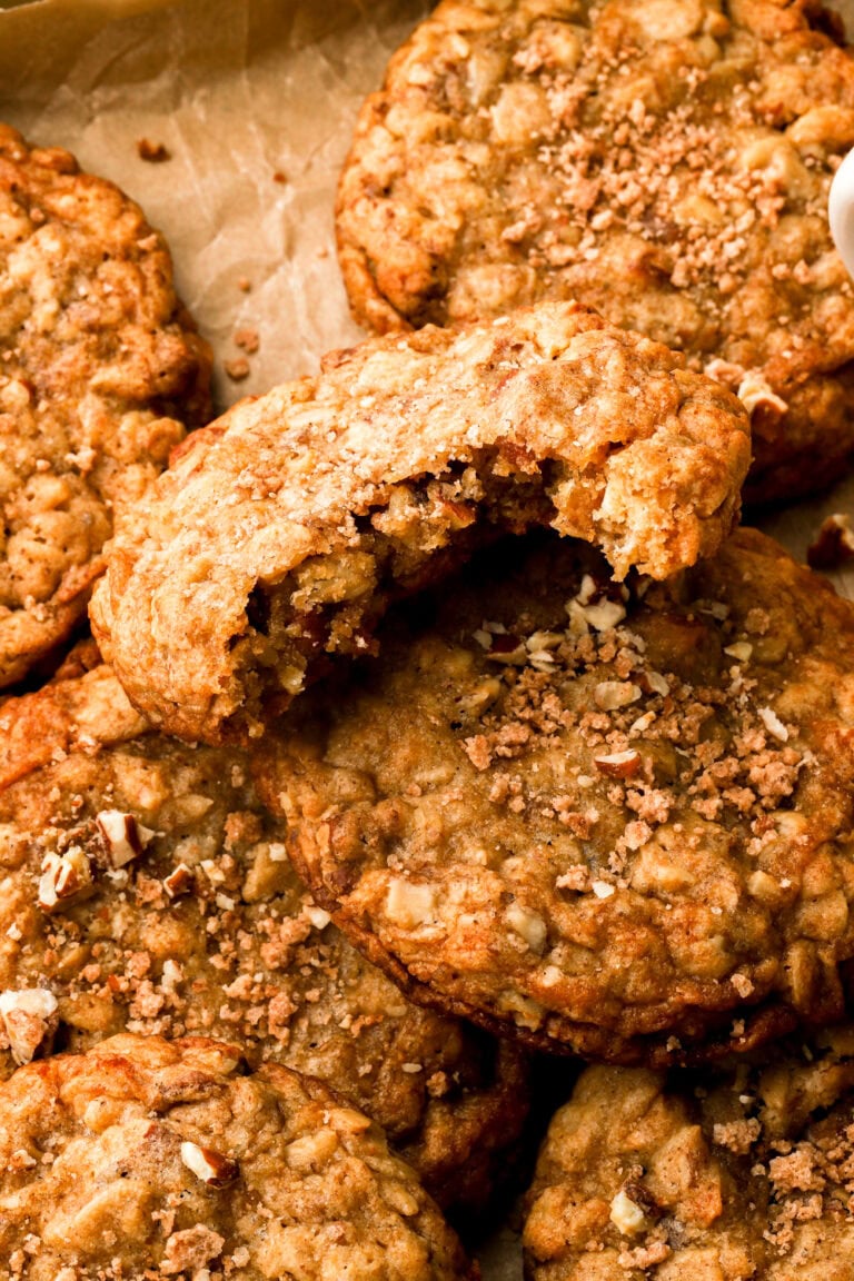 close up of a pecan oatmeal cookie with a bite taken out