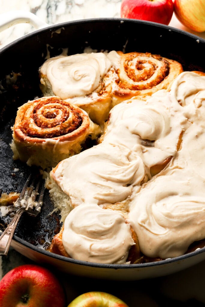 apple cinnamon rolls, frosted in a pan