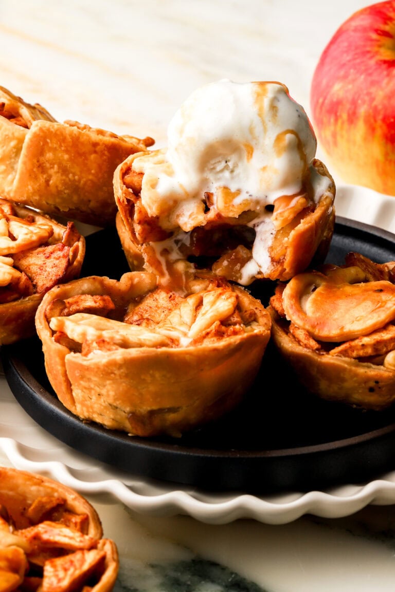 mini apple pies topped with vanilla ice cream