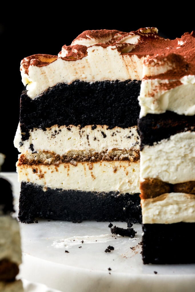 chocolate tiramisu cake close up with a slices removed