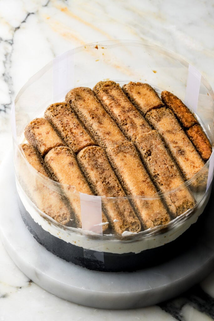 lady fingers layered into black cocoa cake