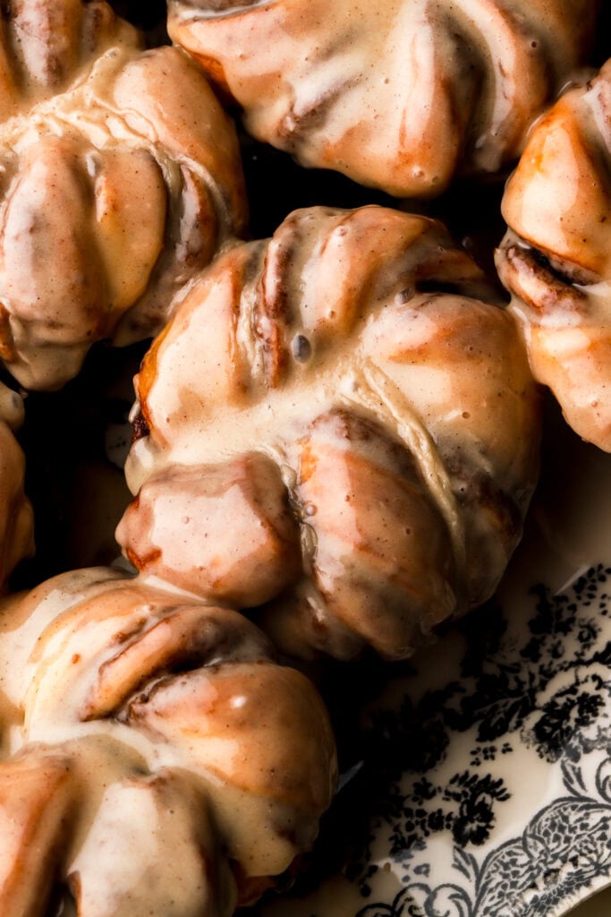 close up of cinnamon knots covered in honey glaze