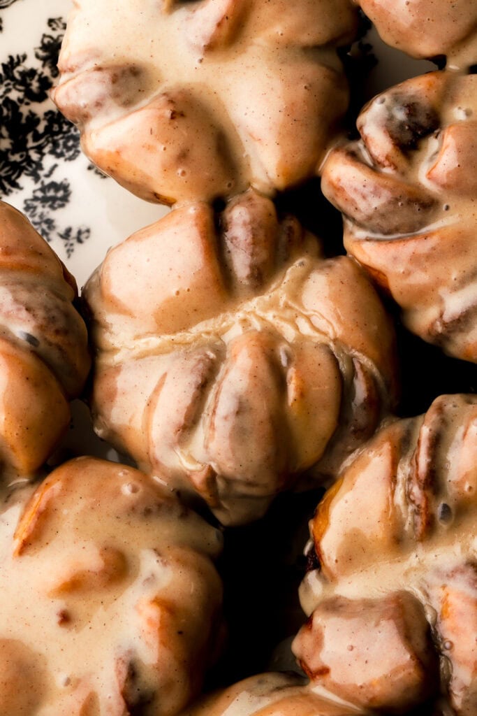 close up of cinnamon knots covered in honey cinnamon glaze