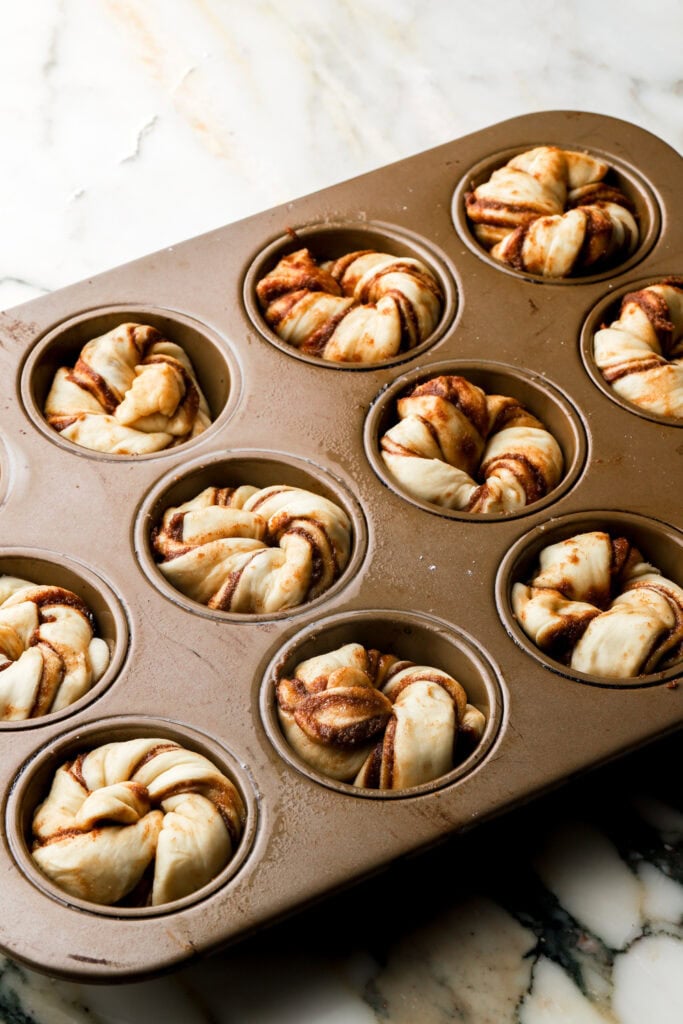 knots placed into a greased muffin tin