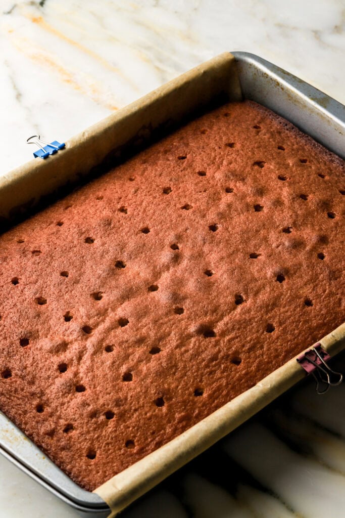 holes poked into cake after it's cooled