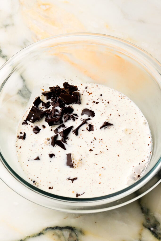 hot cream poured over chocolate for ganache