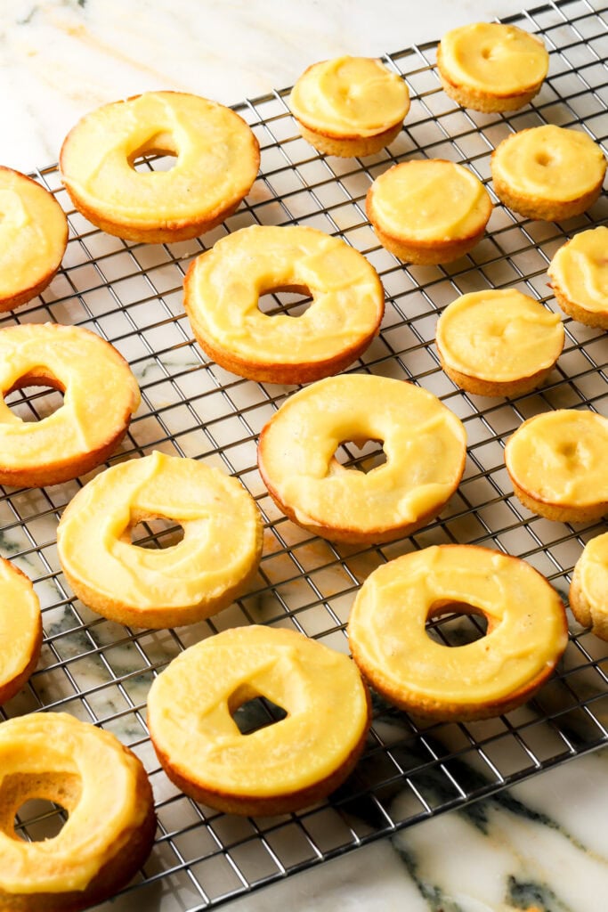 lemon curd spread on top of the donuts