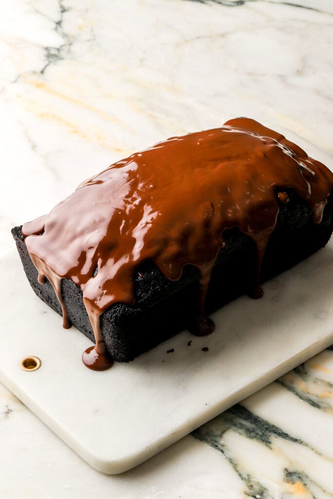 chocolate ganache spread on top of loaf cake
