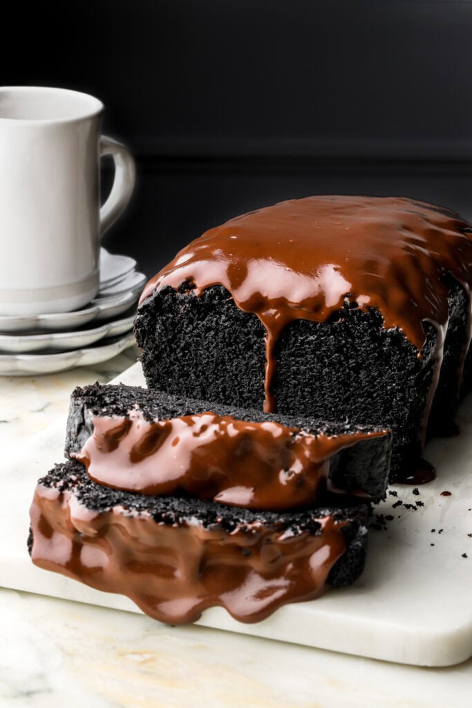black cocoa loaf cake with chocolate ganache dripping