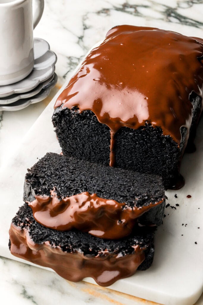 black cocoa loaf cake with chocolate ganache dripping