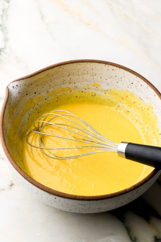 egg yolks whisked with sugar, vanilla and salt