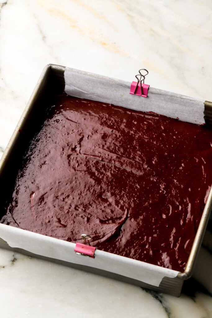the rest of the brownie batter poured on top of the cheesecake batter