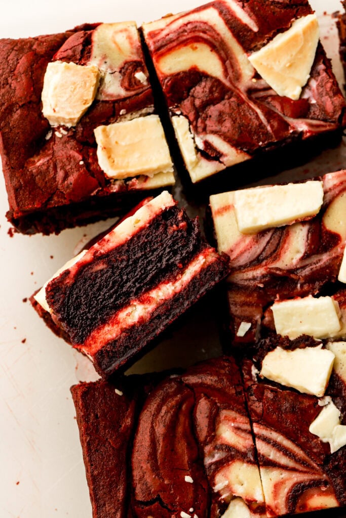 slice of red velvet cheesecake brownies on it's side