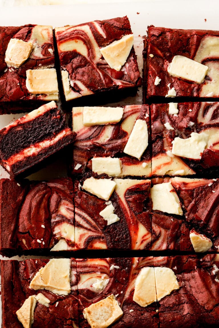 Red velvet cheesecake brownies sliced and showing the inside