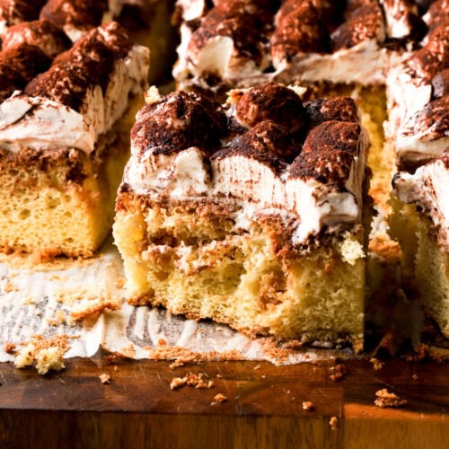 slice of tiramisu cake with a bite taken out