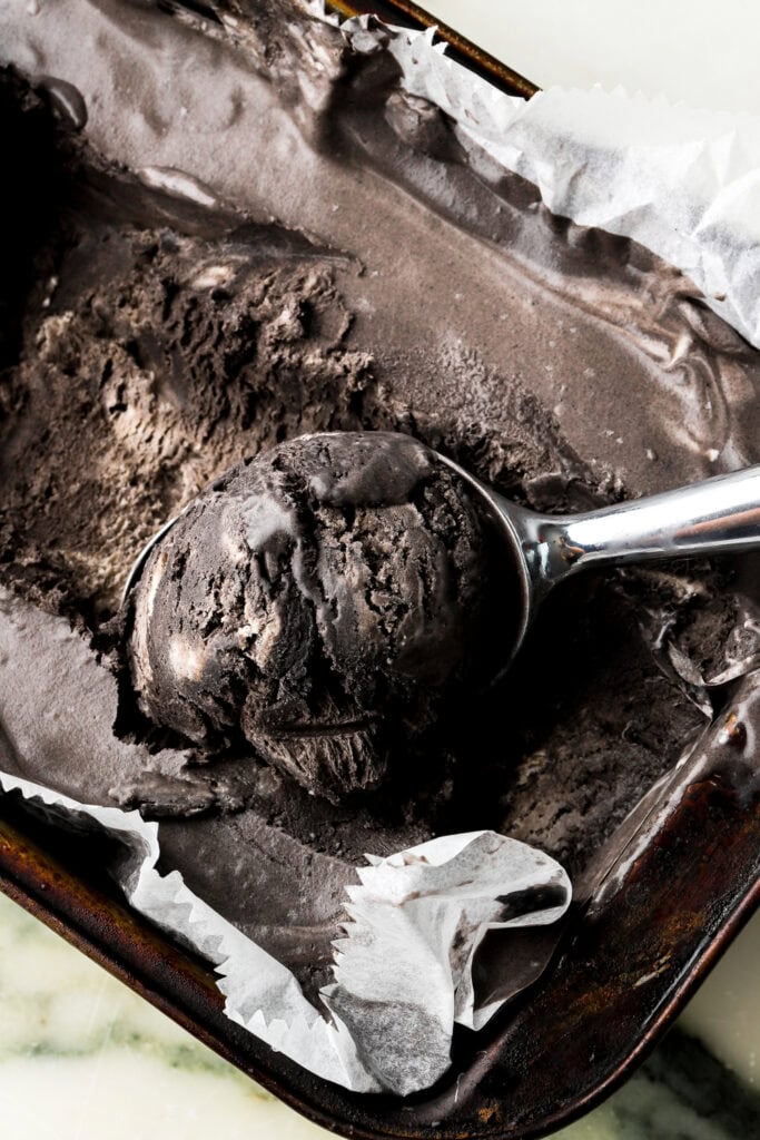 Black cocoa ice cream with a scoop