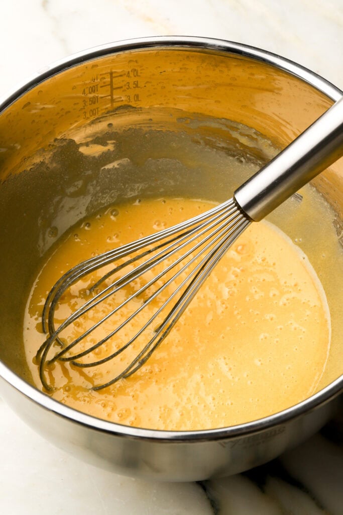 egg whisked into batter, one at a time