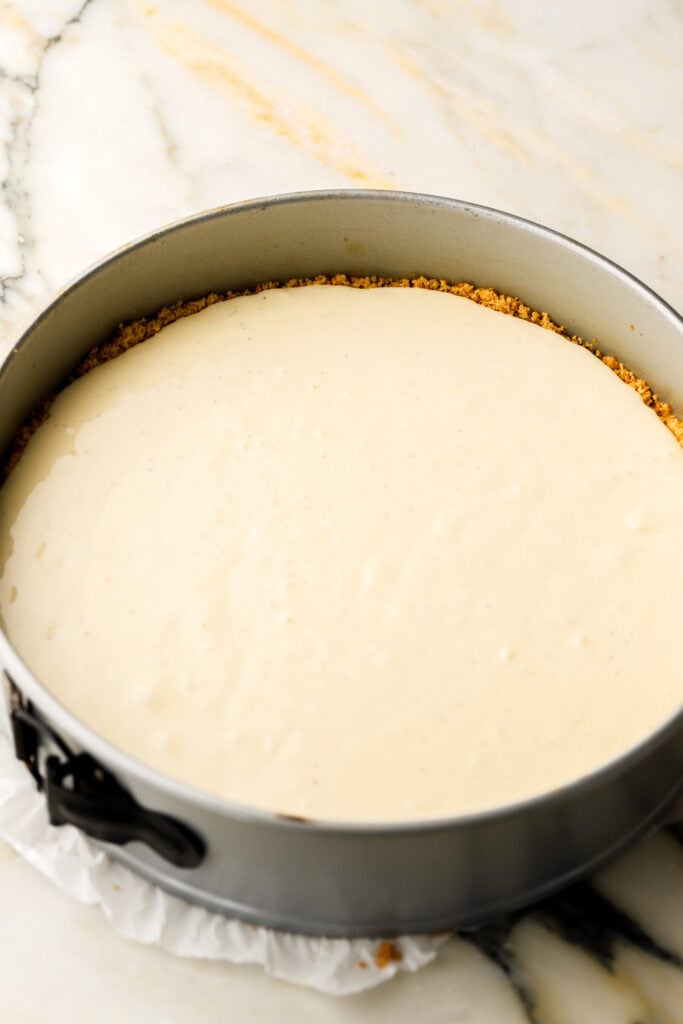 half of cheesecake batter poured in