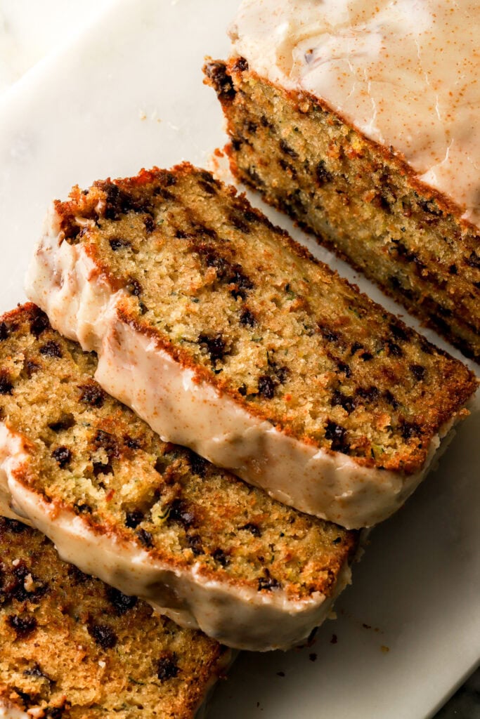 chocolate chip zucchini loaf sliced on a board