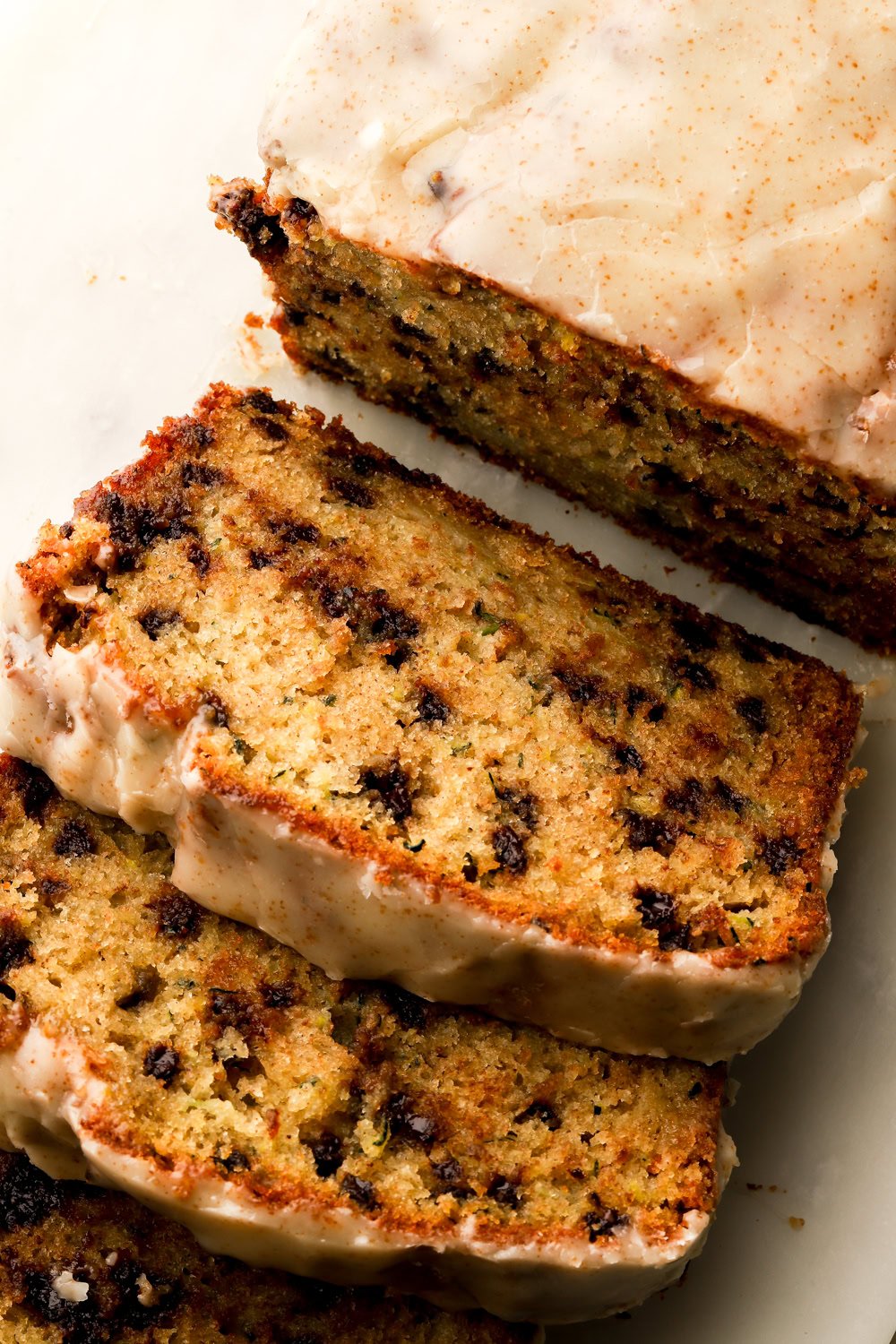 chocolate chip zucchini loaf sliced on a board