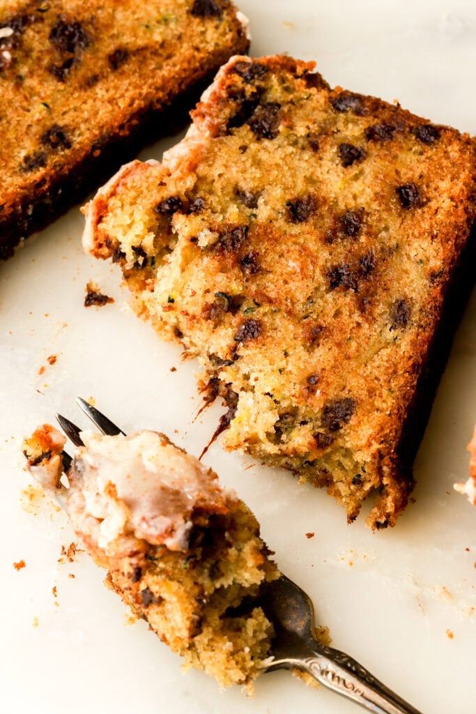 slice of chocolate chip zucchini loaf with a bite taken out