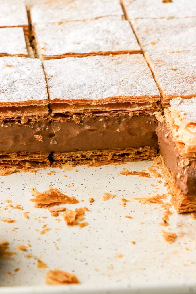 chocolate custard slices sliced on a cookie sheet