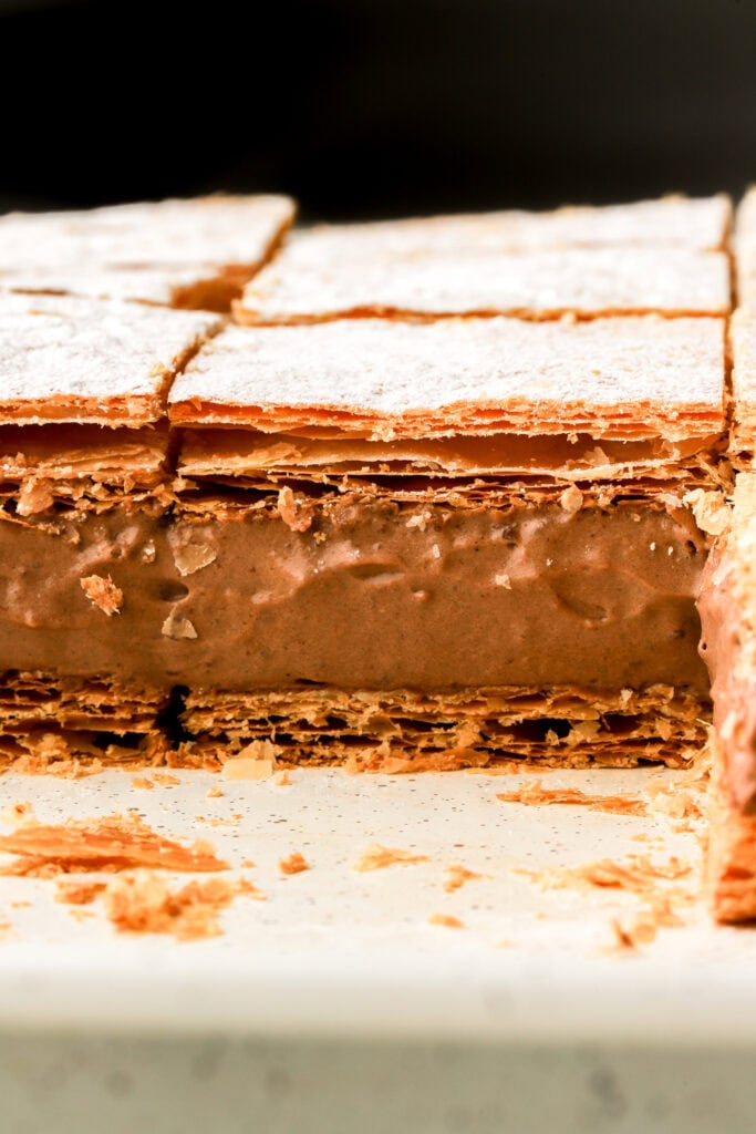chocolate custard slices sliced on the pan