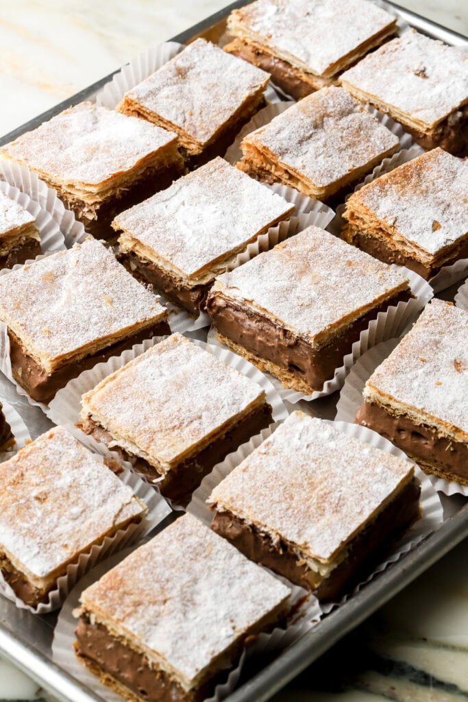 refrigerate until firm before slicing, top with powdered sugar