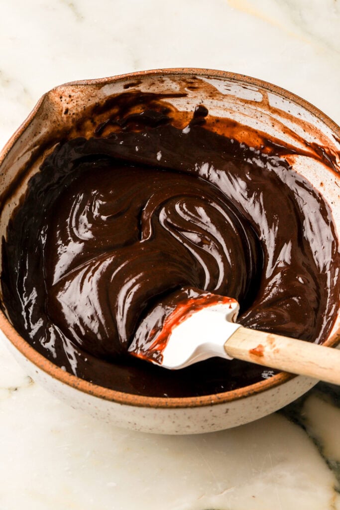 custard poured over chocolate chips and mixed once melted