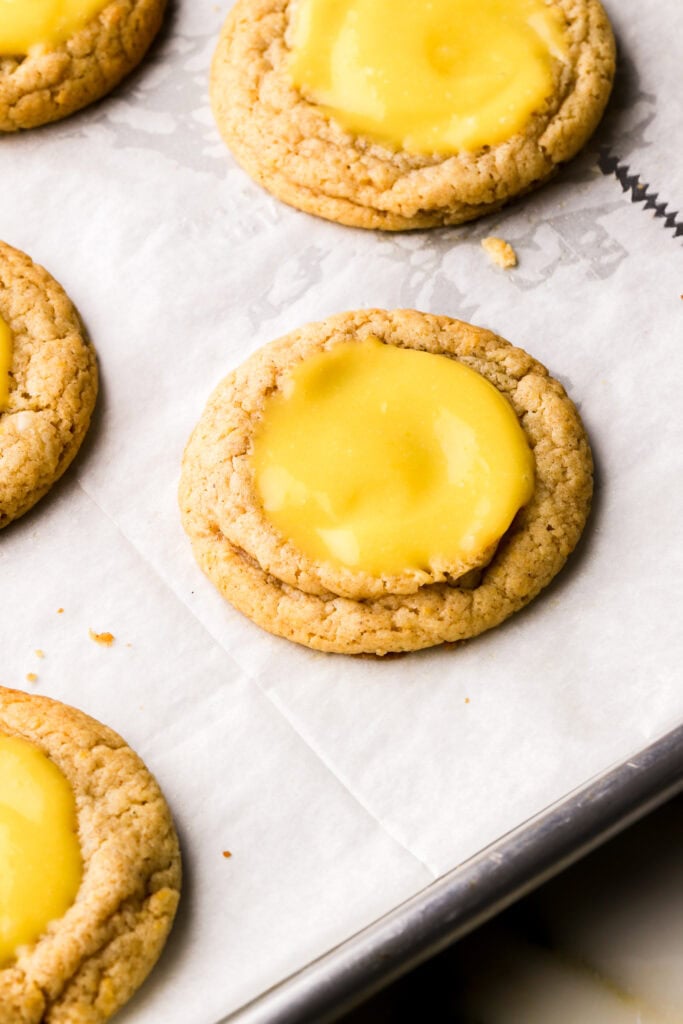 lemon curd in the center of the cookies