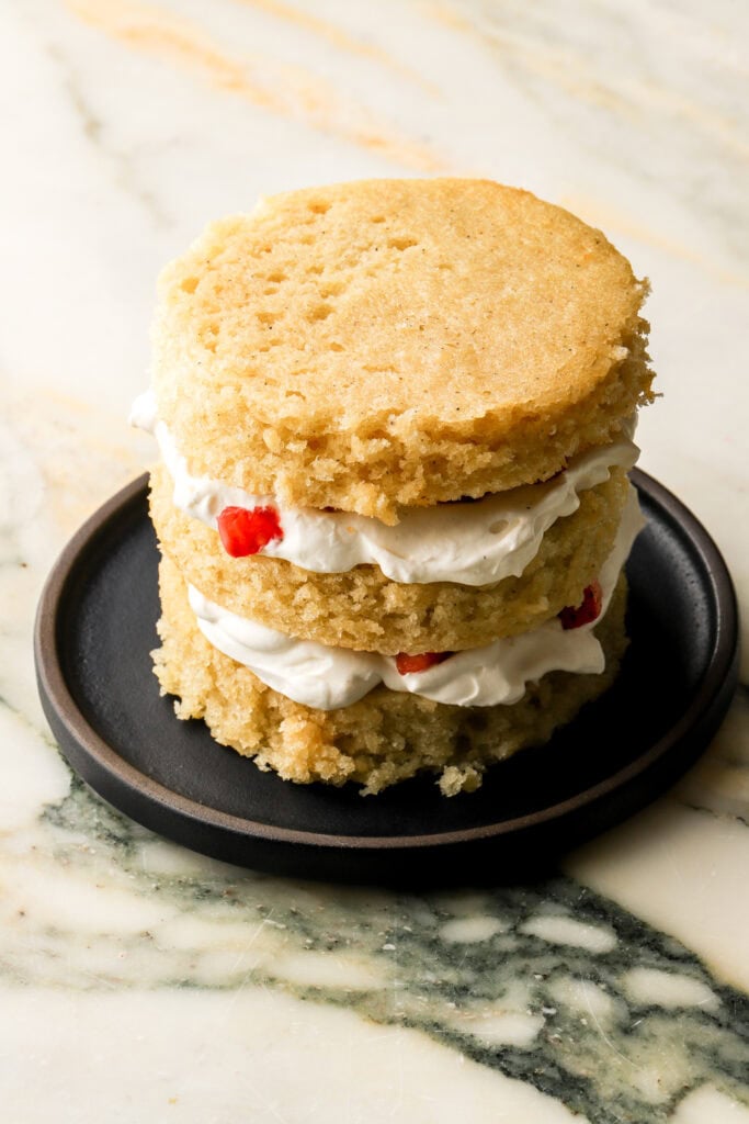 chantilly cream and strawberry chunks layered with vanilla cake
