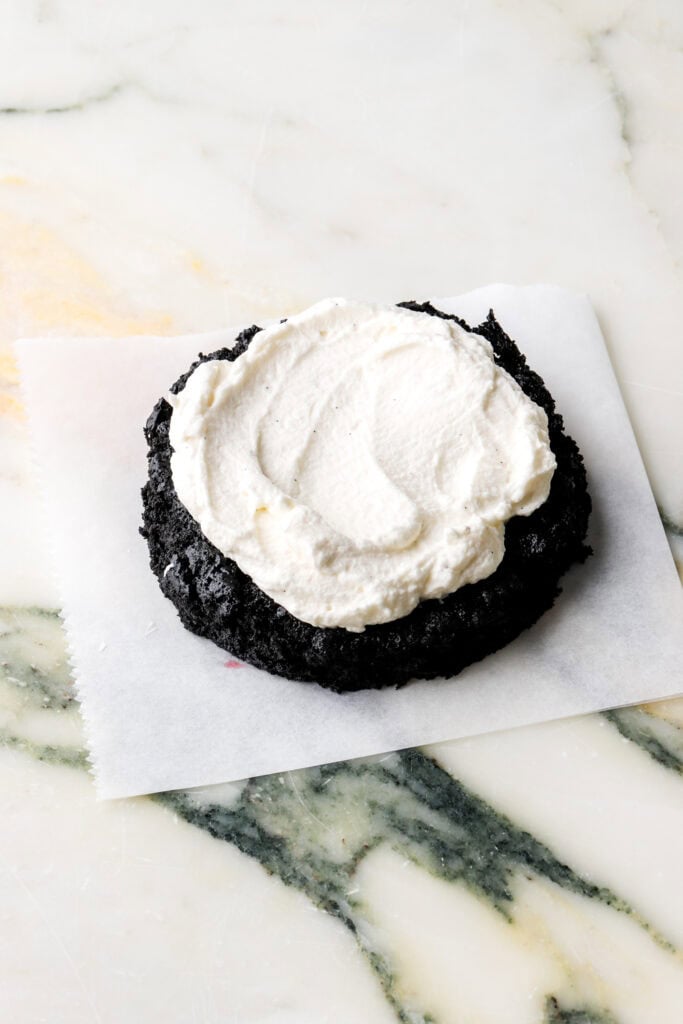 mascarpone cream spread on top of mini chocolate cake