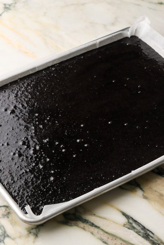 cake batter poured into prepared cake pan